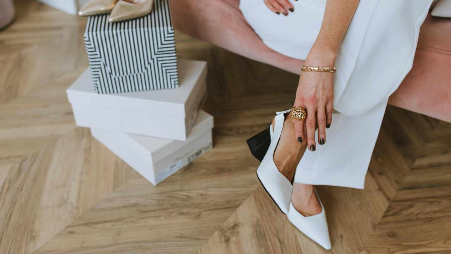 Woman Trying on Shoes in Shoe Shop